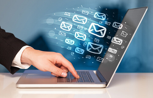 sending email on laptop
