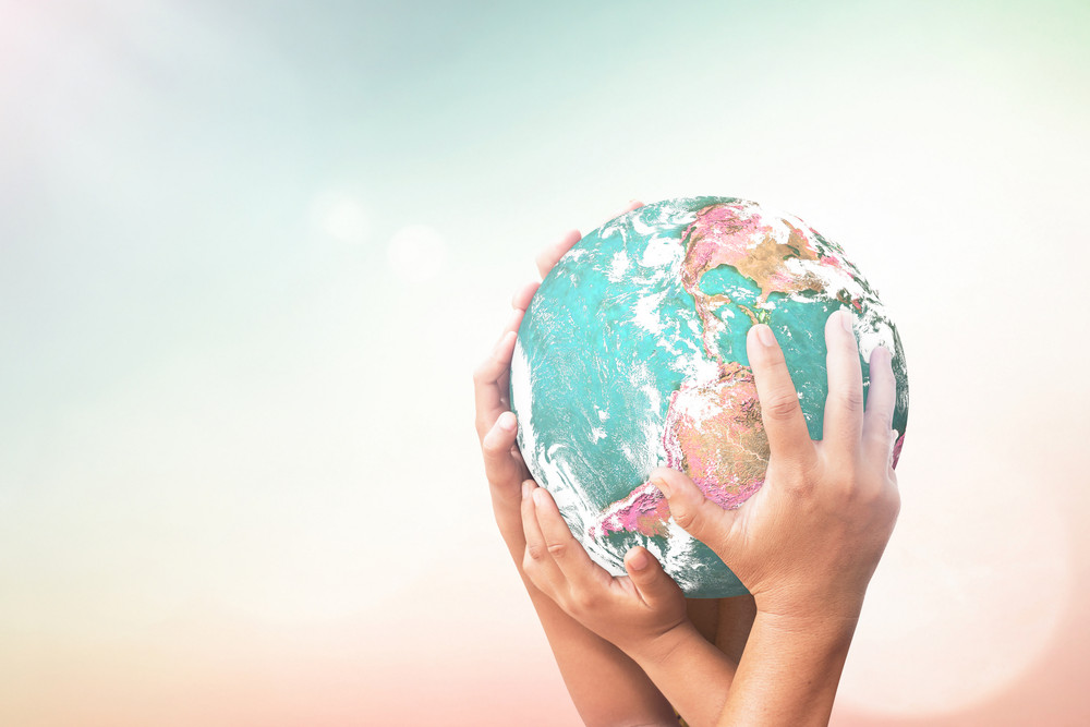 hands holding up a globe